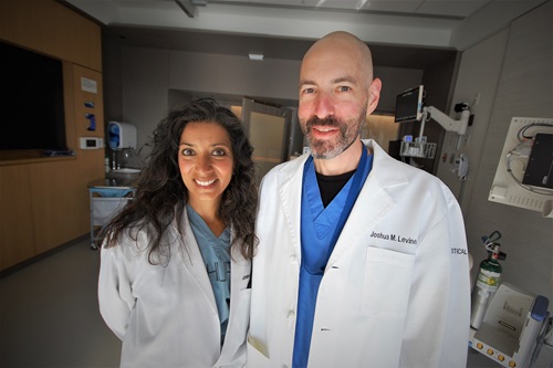 Levin and Kumar smiling